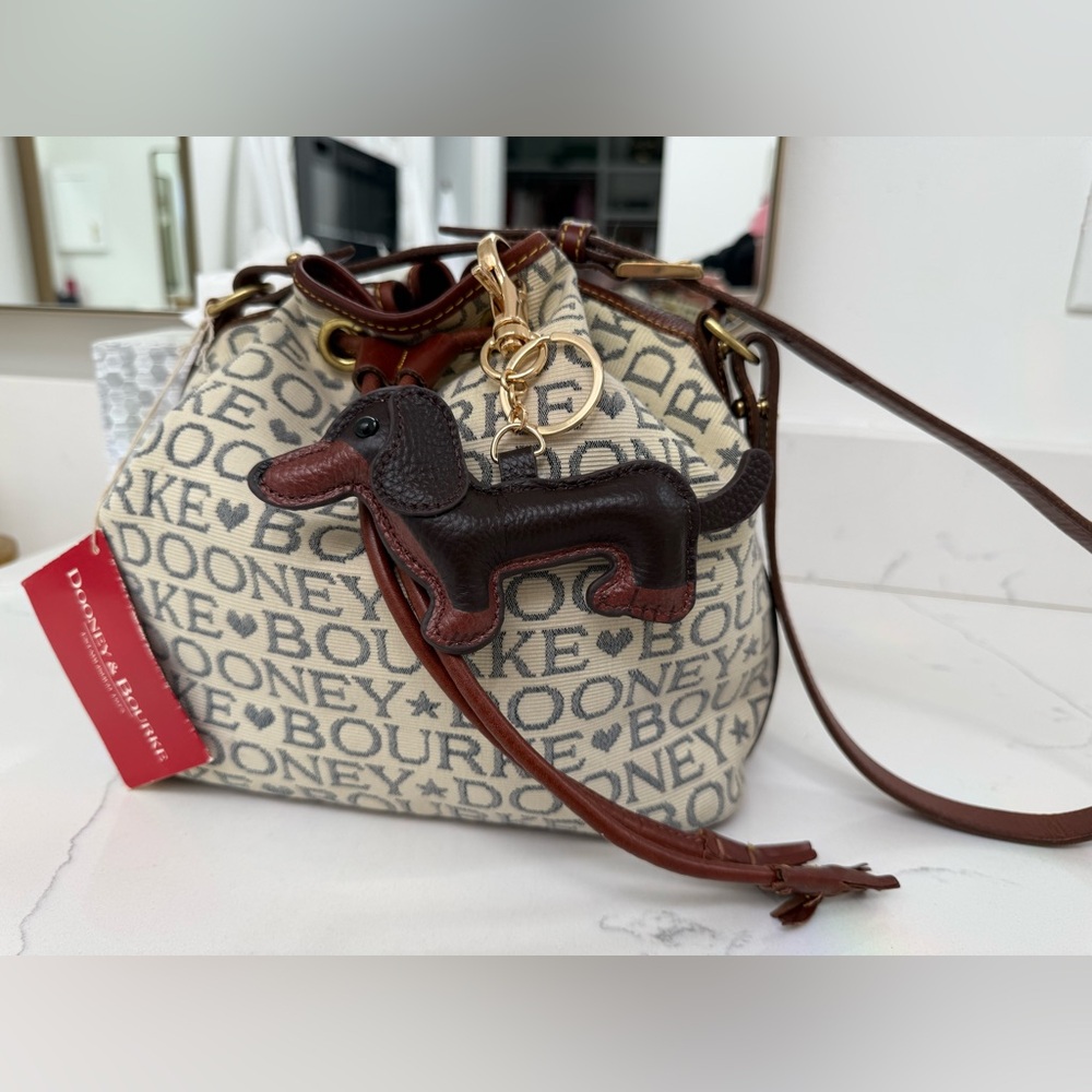 Dooney & Bourke Ivory and Brown Bucket Bag with Dachshund Leather Charm